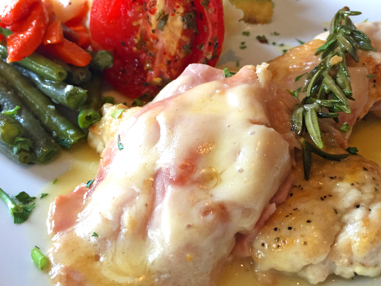 The pollo al rosmarino at Francoli's is served with seasonal vegetables. The pollo al rosmarino at Francoli's is served with seasonal vegetables.