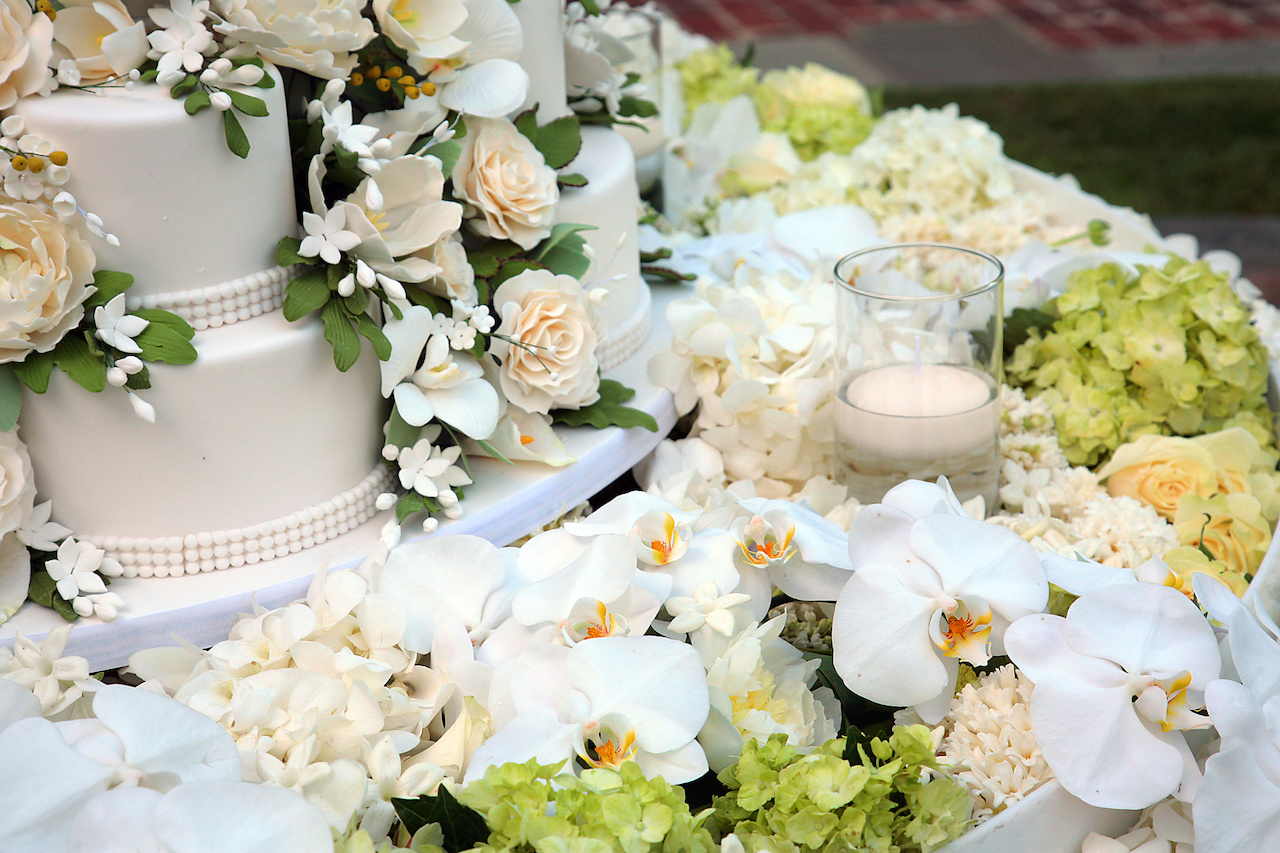 Le Fleur created arrangements of cream and white flowers including hydrangeas and orchids, the bride’s favorites. Le Fleur created arrangements of cream and white flowers including hydrangeas and orchids, the bride’s favorites.