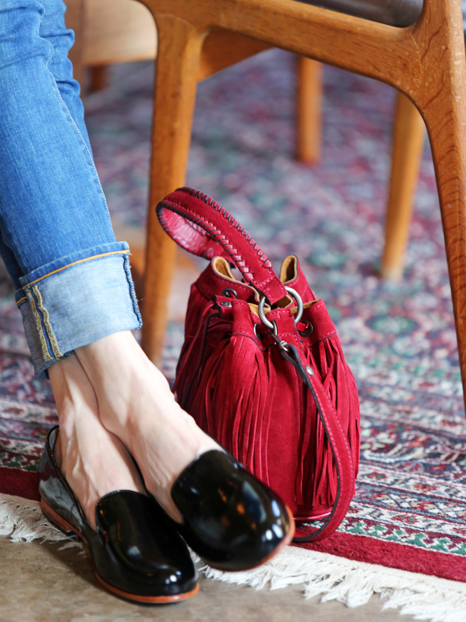 Red - in any shade - is a power color. A cherry bucket bag is the perfect piece for fall
