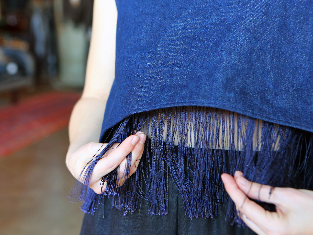 We're falling for fringe. A closeup of the fringe on one of Nashville designer Ona Rex's tops.