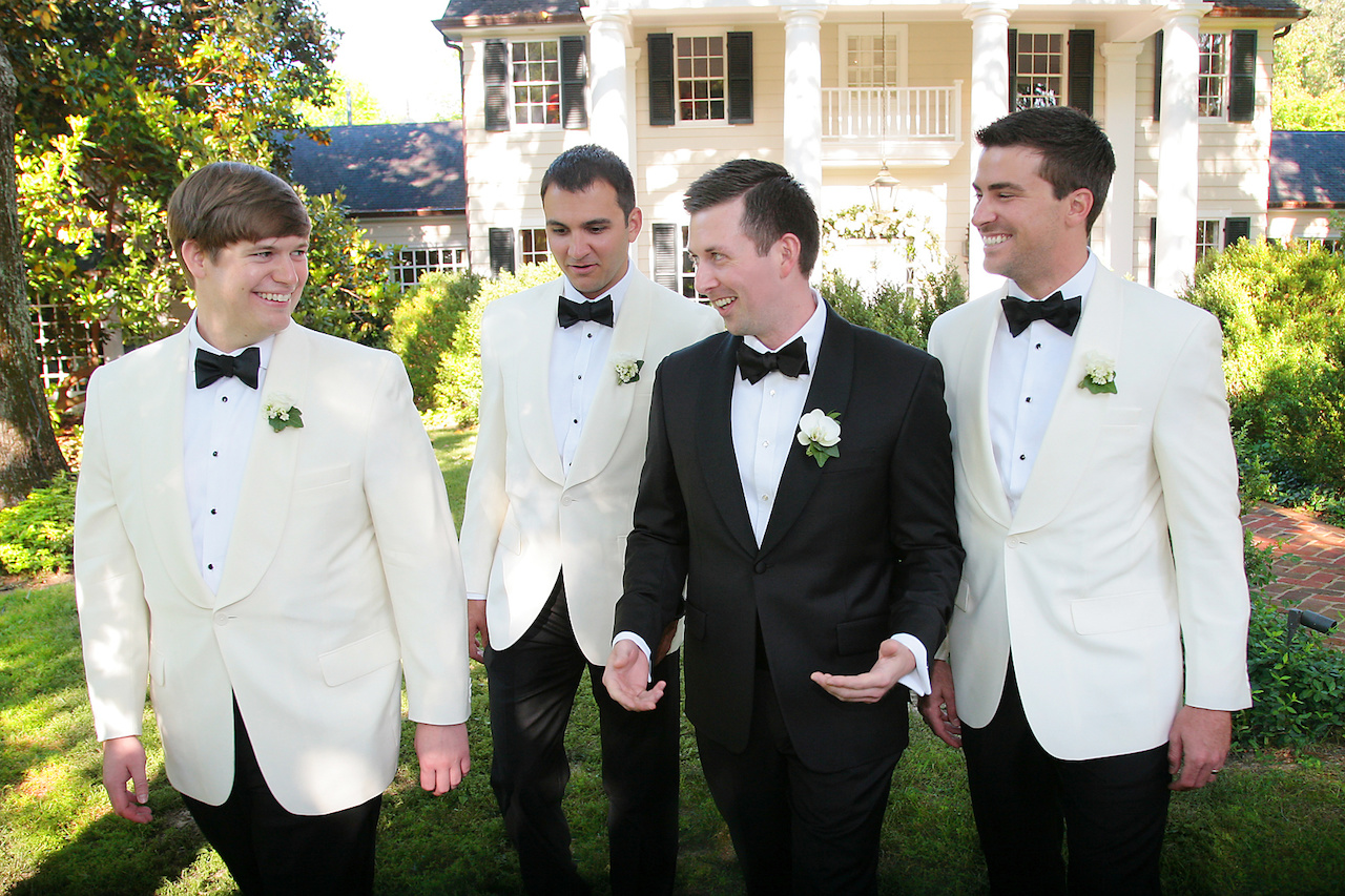Matthew had his tuxedo specially made for him at a trunk show, and one of the gifts to the groomsmen were the white dinner jackets they wore during the wedding, which separated them from Matthew’s. His best man was his best friend Zach Harris. He had two groomsmen, his closest friends Nick Myers and Trey Bowling. Because they wanted friends and family to be involved, Matthew invited a group of about 10 guys to spend the day together. Matthew had his tuxedo specially made for him at a trunk show, and one of the gifts to the groomsmen were the white dinner jackets they wore during the wedding, which separated them from Matthew’s. His best man was his best friend Zach Harris. He had two groomsmen, his closest friends Nick Myers and Trey Bowling. Because they wanted friends and family to be involved, Matthew invited a group of about 10 guys to spend the day together.
