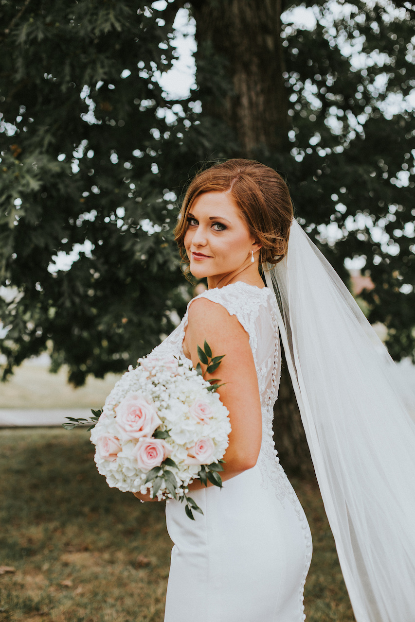Ashley looking beautiful and bridal in her Jewel dress from David’s Bridal. Murdock Wedding|styleblueprint.com