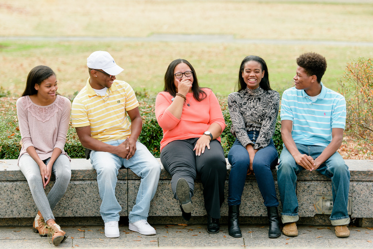 T. Marie laughs with some of the students she works with. T. Marie laughs with some of the students she works with.