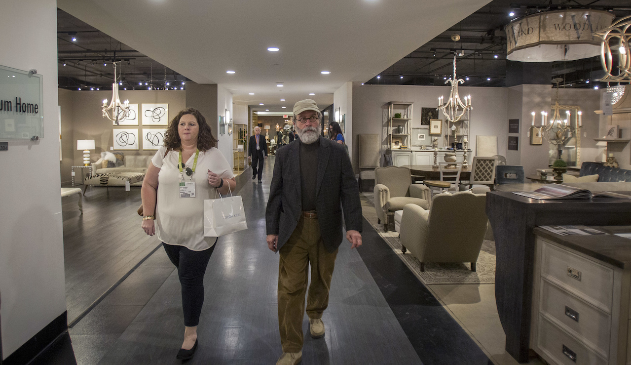 Stacy and Michael move through the first few floors of the IHFC with focus; they know exactly which exhibitors they will visit, from lighting vendors to outdoor furniture companies. Stacy and Michael move through the first few floors of the IHFC with focus; they know exactly which exhibitors they will visit, from lighting vendors to outdoor furniture companies.