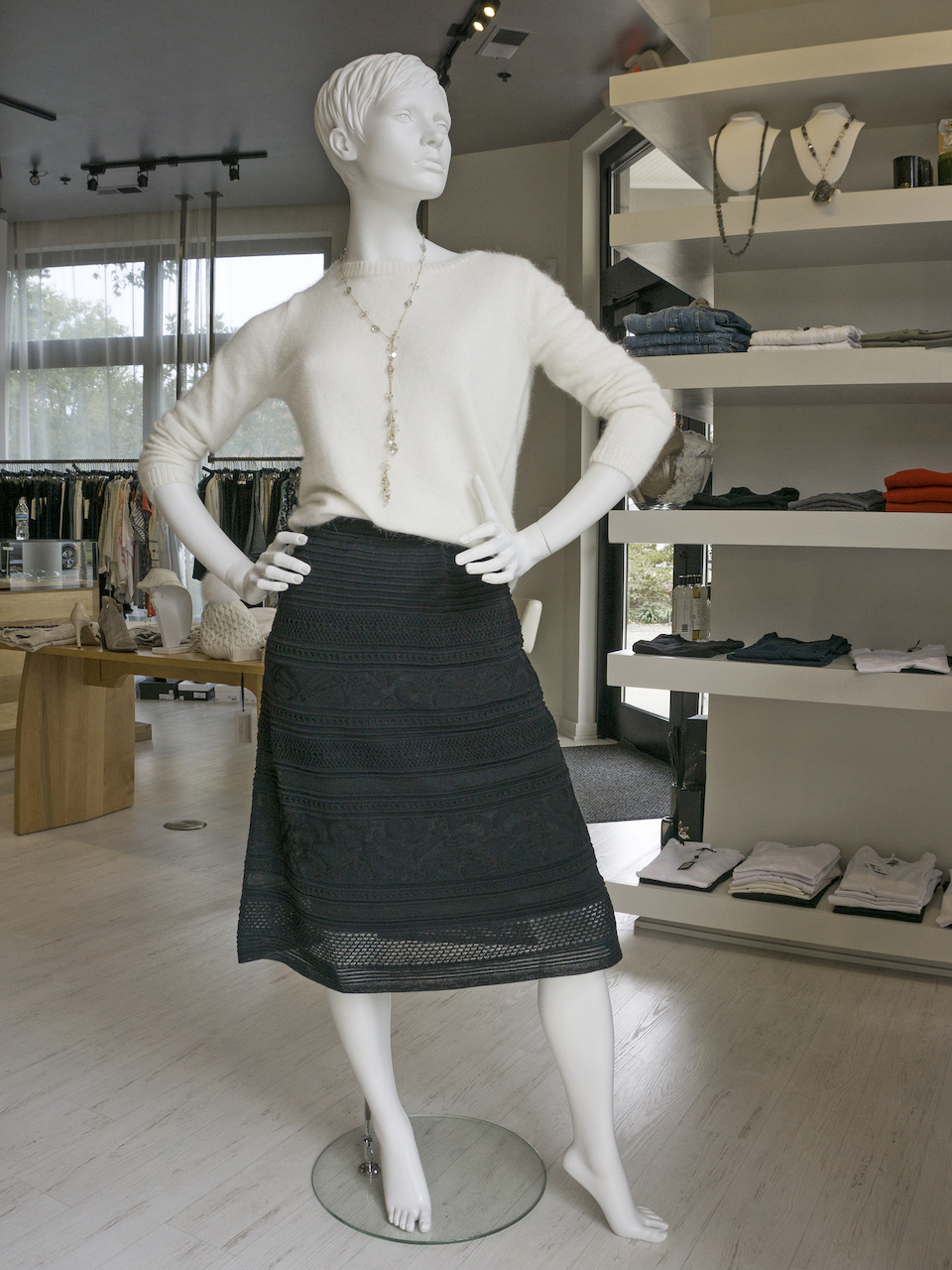 White sweater, $325; Missoni knit black A-line skirt, $675; Necklace, $525 White sweater, $325; Missoni knit black A-line skirt, $675; Necklace, $525