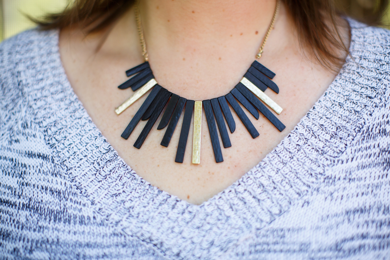 A black and gold metal necklace, $25 from The Attic, makes a statement and adds shine. A black and gold metal necklace, $25 from The Attic, makes a statement and adds shine.
