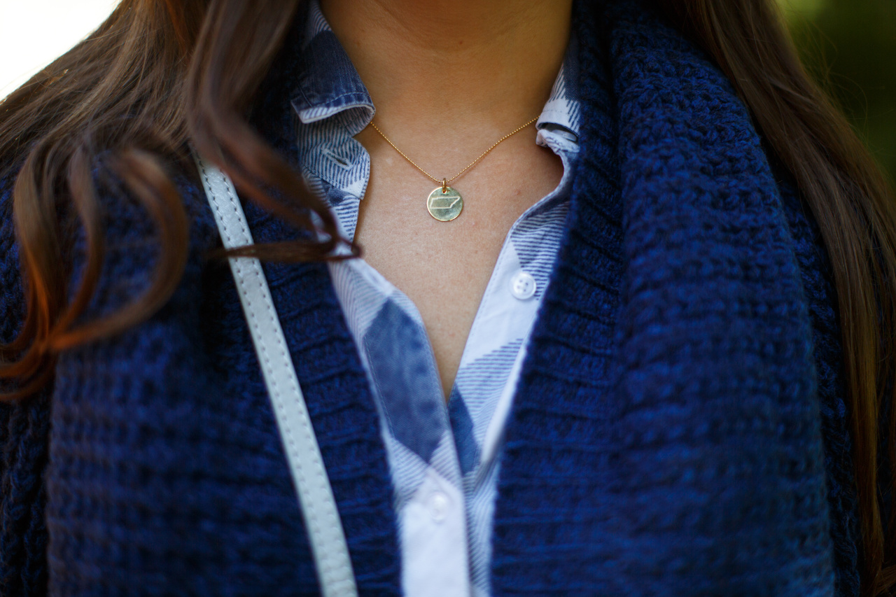 Texture and pattern, with a simple sparkle of gold: Rails Carter midnight check top, $148; Dex cobalt cardigan, $84 and Tennessee necklace, $24 at The Attic Texture and pattern, with a simple sparkle of gold: Rails Carter midnight check top, $148; Dex cobalt cardigan, $84 and Tennessee necklace, $24 at The Attic