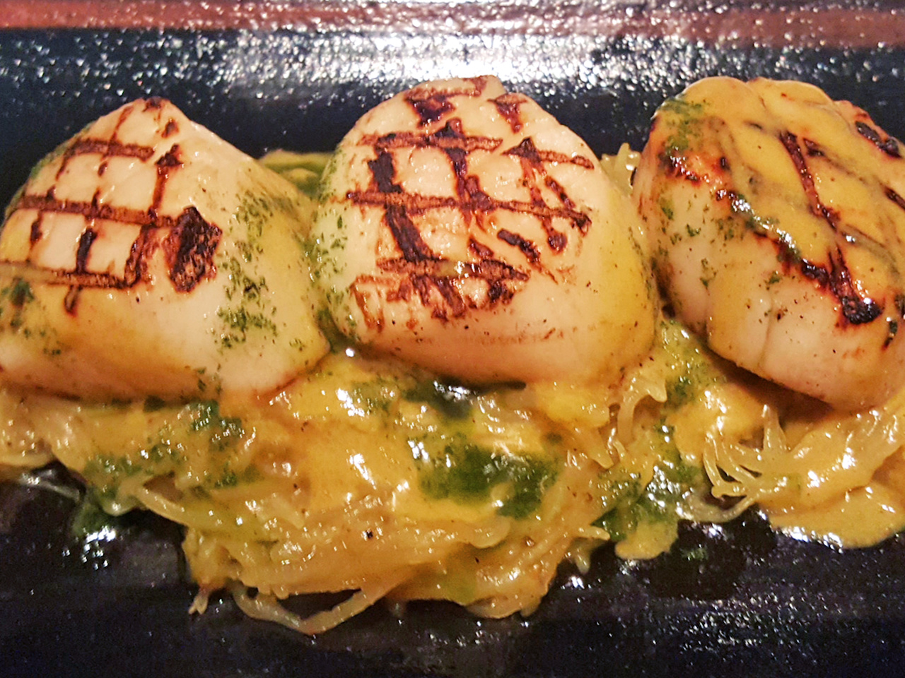 The diver scallops feature curried spaghetti squash and pumpkin oil for $15. The diver scallops feature curried spaghetti squash and pumpkin oil for $15.