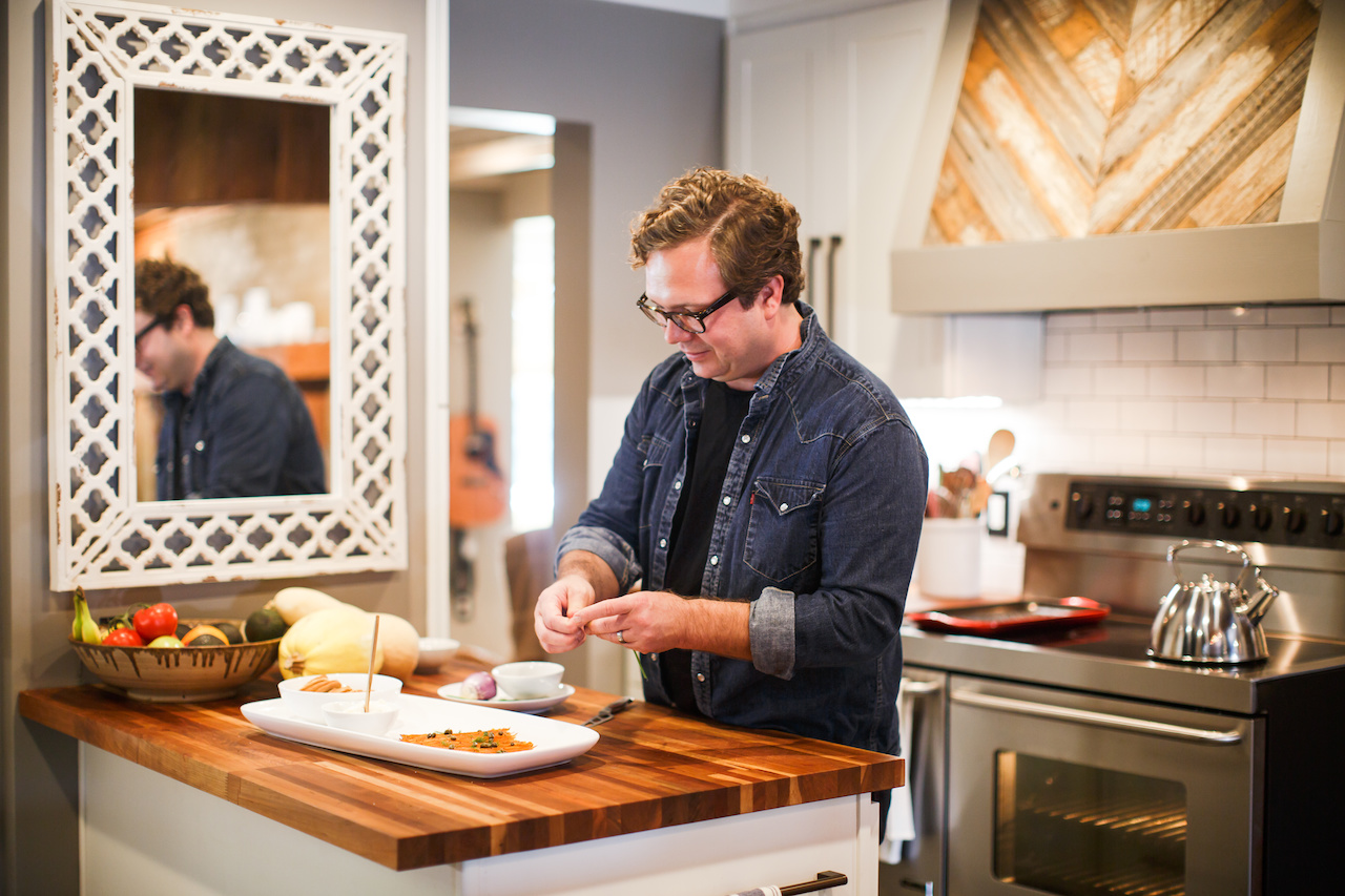 At a smaller second island, Justin is whipping up a treat for us! The counters on both islands are functional butcher block. At a smaller second island, Justin is whipping up a treat for us! The counters on both islands are functional butcher block.
