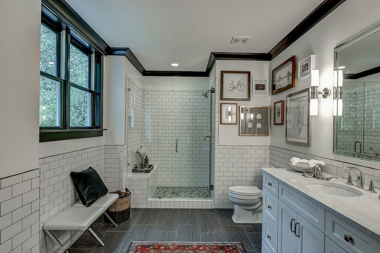 We're in love with these subway tiles extending from the shower all the way to the vanity. leah atkins design styleblueprint atlanta bathroom