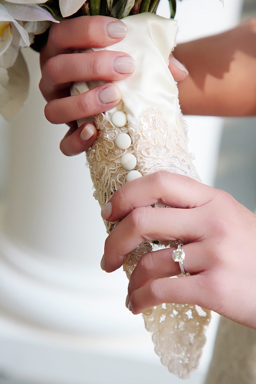 A sleeve from her mom’s wedding dress was repurposed as a bouquet sleeve and served as another something old and borrowed. A sleeve from her mom’s wedding dress was repurposed as a bouquet sleeve and served as another "something old" and "something borrowed." A sleeve from her mom’s wedding dress was repurposed as a bouquet sleeve and served as another something old and borrowed. A sleeve from her mom’s wedding dress was repurposed as a bouquet sleeve and served as another "something old" and "something borrowed."