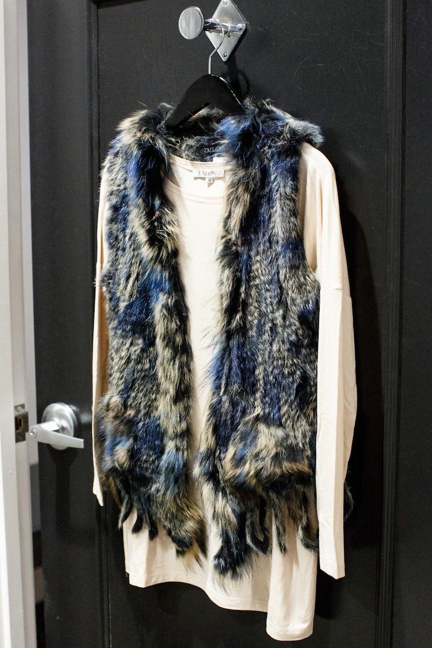 Fur vest by Dolce Cabo, $262 and Joy Joy pullover, $48 from Lori James Fur vest by Dolce Cabo, $262 and Joy Joy pullover, $48 from Lori James