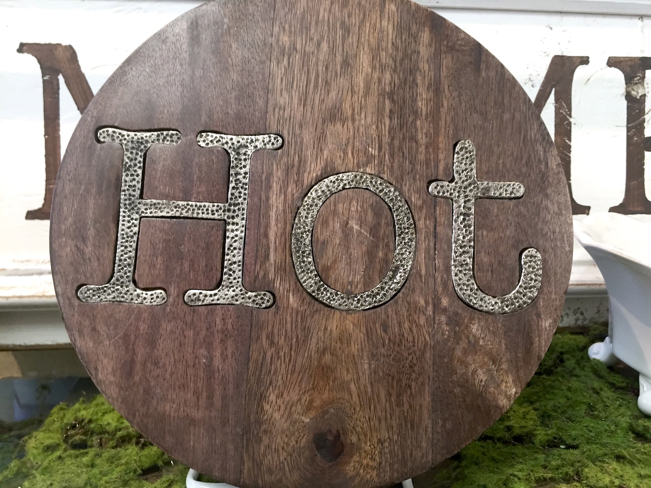 Wood and metal hot plate, $24 at More Than Words Wood and metal hot plate, $24 at More Than Words