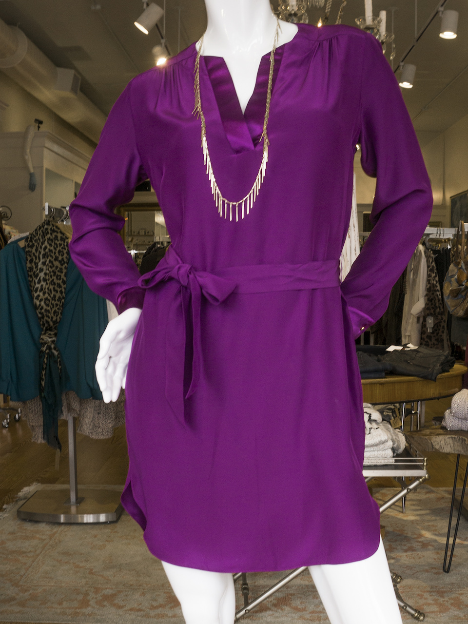 From Liv Boutique: Eggplant silk belted dress, $226; fringe necklace, $26 From Liv Boutique: Eggplant silk belted dress, $226; fringe necklace, $26