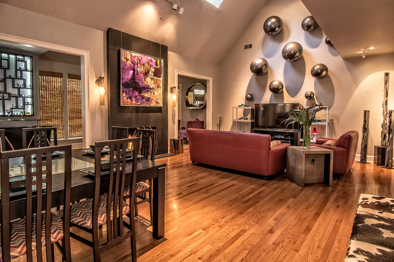 When choosing design elements for this modern living room, Ami went with her client’s preferred style of masculinity, though she added touches of panache. A few of these included a foundational seating and media area to ground the space; a custom fireplace screen designed to appear like waves of tall grass billowing in the wind; and decorative pewter balls arranged as wall art to act as the focal point of the room. When choosing design elements for this modern living room, Ami went with her client’s preferred style of masculinity, though she added touches of panache. A few of these included a foundational seating and media area to ground the space; a custom fireplace screen designed to appear like waves of tall grass billowing in the wind; and decorative pewter balls arranged as wall art to act as the focal point of the room.