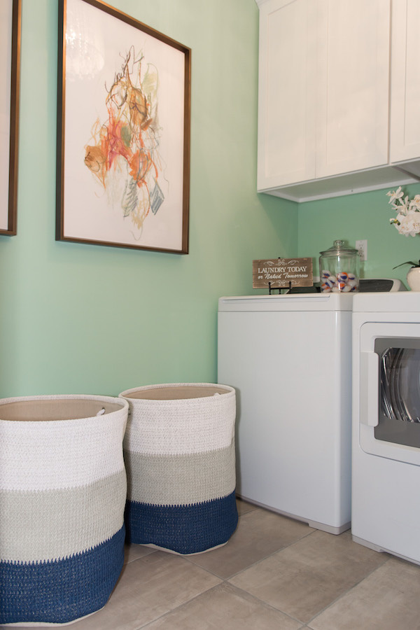 Original art in the laundry room. Yes. Take a look inside the Bellarmine Show House 2016