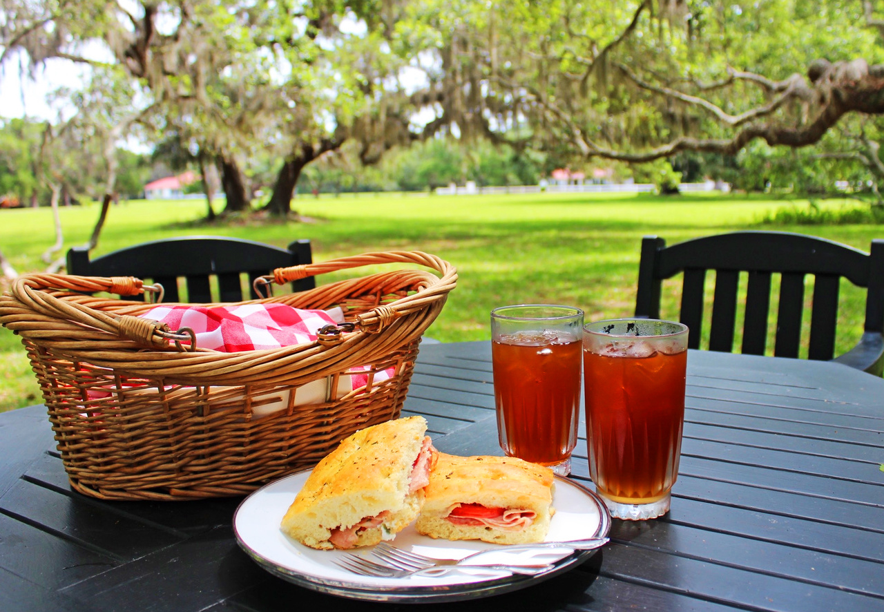 Lunchtime is easy and oh-so-civilized. Guests grab their already-prepared picnic baskets from the kitchen and can take them anywhere to eat, such as under this canopy of trees in the front yard. Lunchtime is easy and oh-so-civilized. Guests grab their already-prepared picnic baskets from the kitchen and can take them anywhere to eat, such as under this canopy of trees in the front yard.