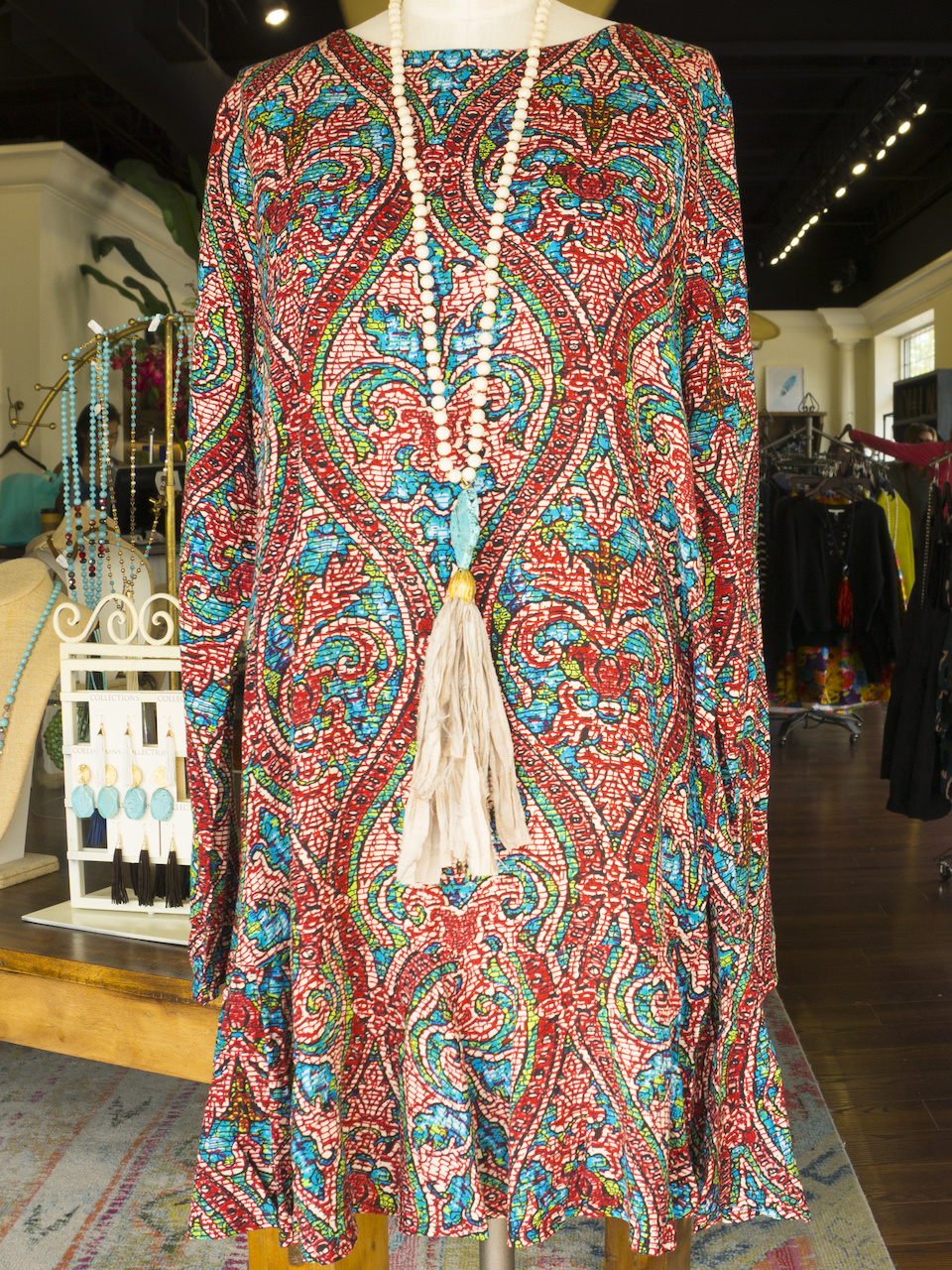 Multi-print dress, $54; Tassle Necklace, $68 Multi-print dress, $54; Tassle Necklace, $68