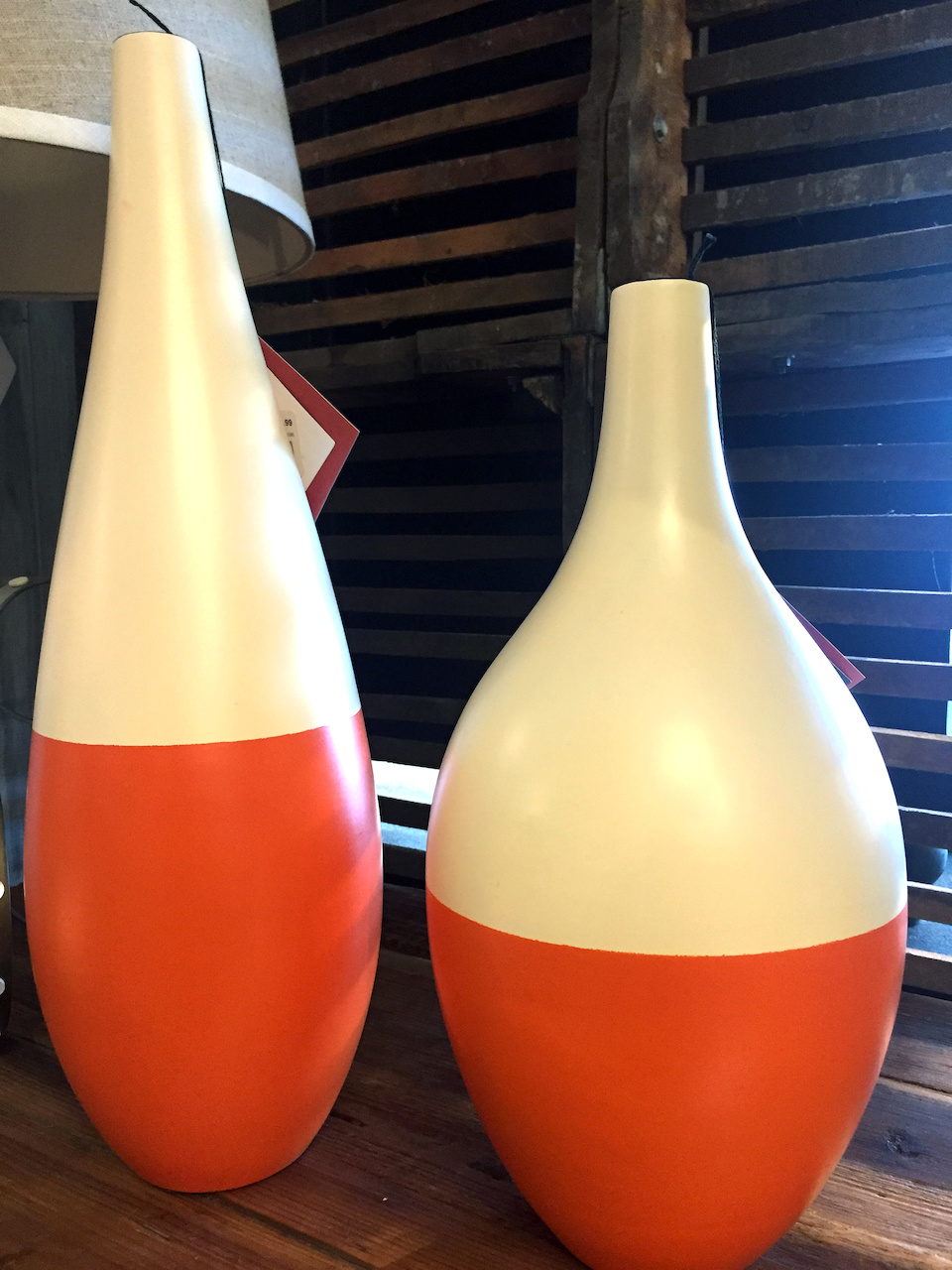 Cream and orange ceramic vases, $19.99 each from Stash Home Cream and orange ceramic vases, $19.99 each from Stash Home