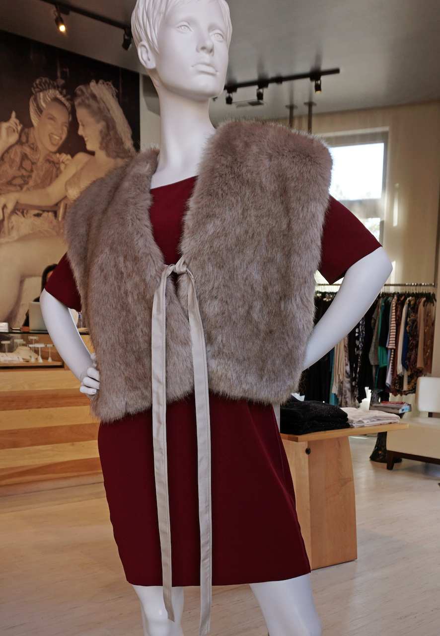 From <a href="https://styleblueprint.com/louisville/guide/peacock-boutique/" target="_blank">Peacock Boutique</a>: Satin back cocoon dress, $495; Becken faux fur vest, $465 From <a href="https://styleblueprint.com/louisville/guide/peacock-boutique/" target="_blank">Peacock Boutique</a>: Satin back cocoon dress, $495; Becken faux fur vest, $465