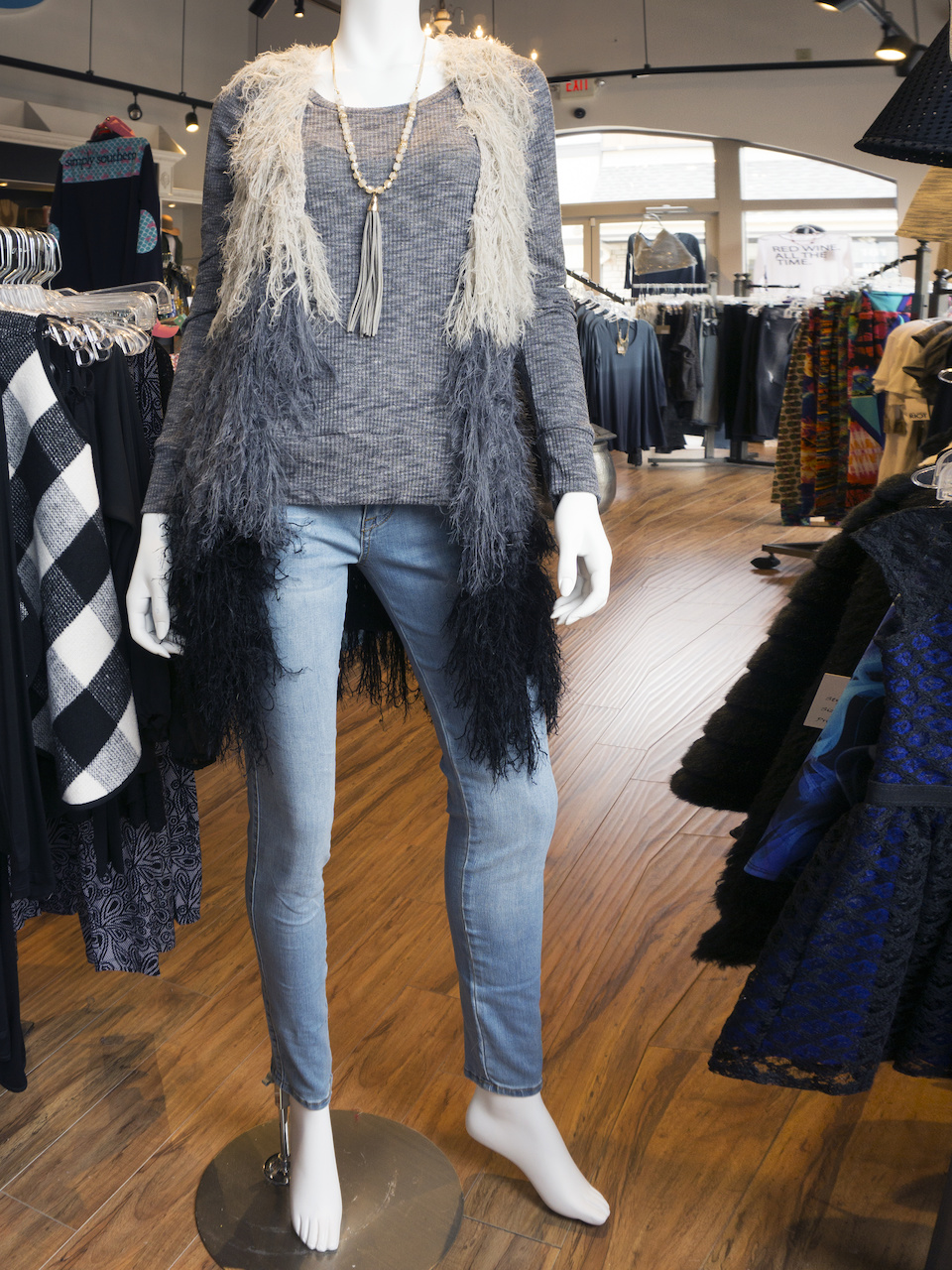 Shaggy vest, $98; Grey long-sleeve top, $40; Tassle necklace, $32 Shaggy vest, $98; Grey long-sleeve top, $40; Tassle necklace, $32