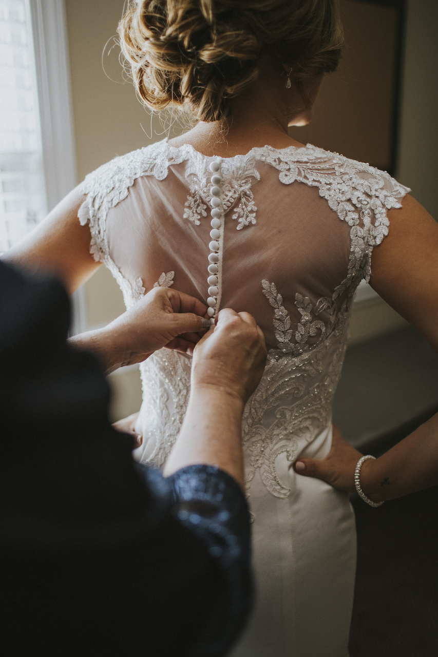 The lace and beaded detail of Ashley’s dress is so elegant and classic. Murdock Wedding|styleblueprint.com