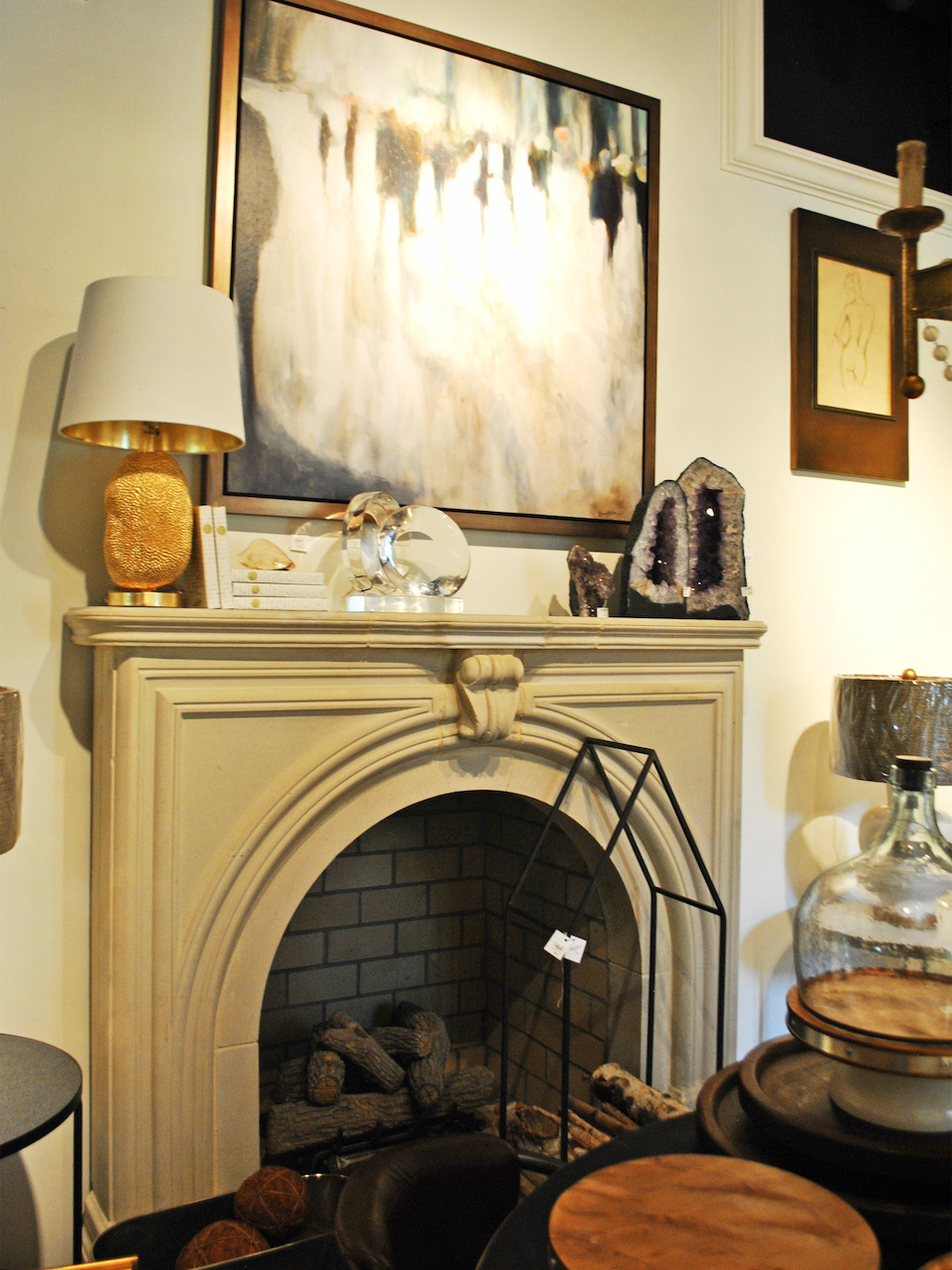 This mantel arrangement incorporates elements of modern art with fragments from nature and traditional architecture for an understated yet elegant feel. This mantel arrangement incorporates elements of modern art with fragments from nature and traditional architecture for an understated yet elegant feel.