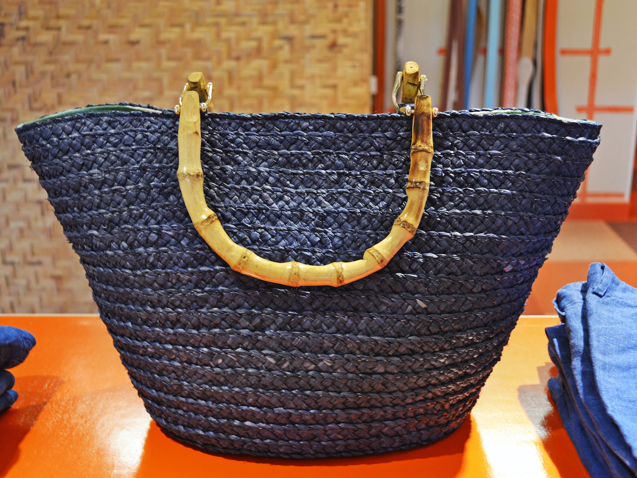Snaps closed so your goodies won't fall out Navy raffia tote at J. McLaughlin