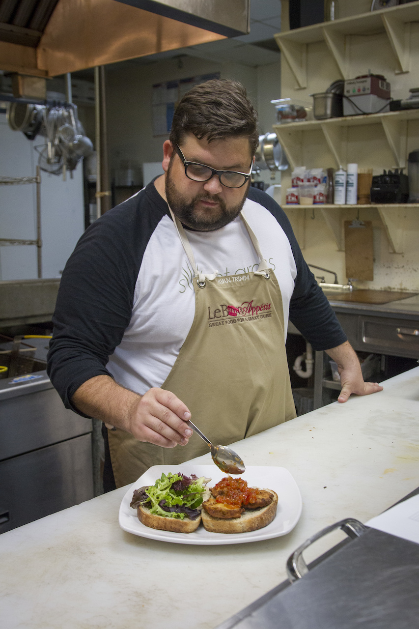 Ryan adds the house made sweet pepper relish to the sandwich. All that's missing is the bacon! Ryan adds the house made sweet pepper relish to the sandwich. All that's missing is the bacon!