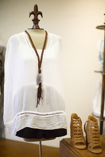 From Sorelle: Unstructured white silk top with camisole by Temp Paris, $68; black Lilla P. shorts with side pockets,$102; Dolce Vita lace-front, side-zip sandals, $190 and Gold + Stone braided leather necklace, $68. From Sorelle: Unstructured white silk top with camisole by Temp Paris, $68; black Lilla P. shorts with side pockets,$102; Dolce Vita lace-front, side-zip sandals, $190 and Gold + Stone braided leather necklace, $68.