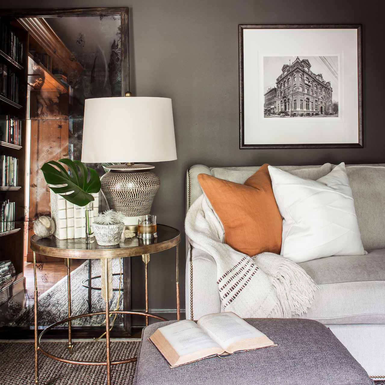 An antique mirror and lighter colors in fabrics and accessories provide layers to this room. SB-Memphis-Sean Anderson-Dark Spaces11.jpg
