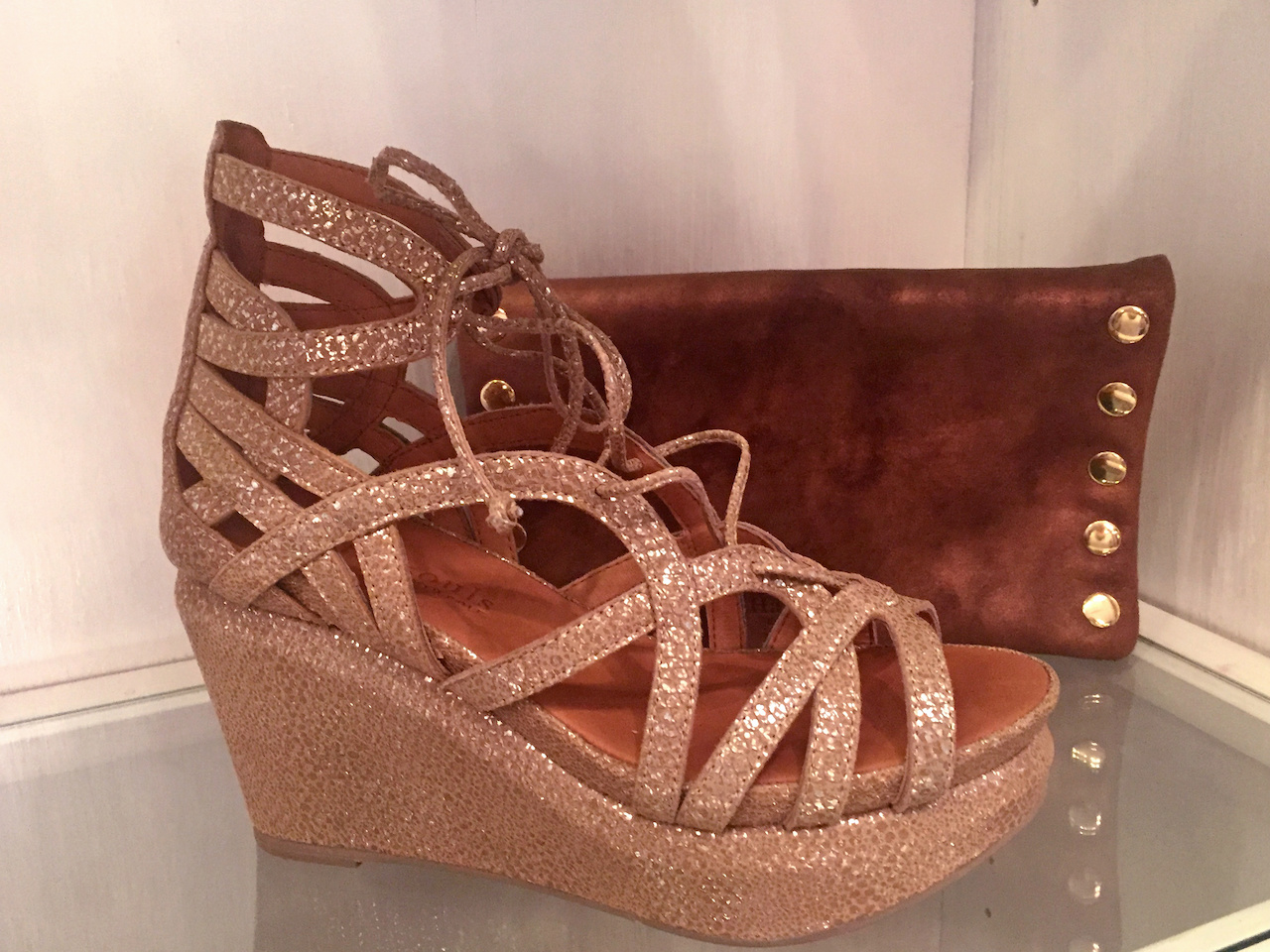 From Theadora Abbeyluxe: Gentle Souls metallic wedges, $230; Hammit bronze clutch, $285 From Theadora Abbeyluxe: Gentle Souls metallic wedges, $230; Hammit bronze clutch, $285