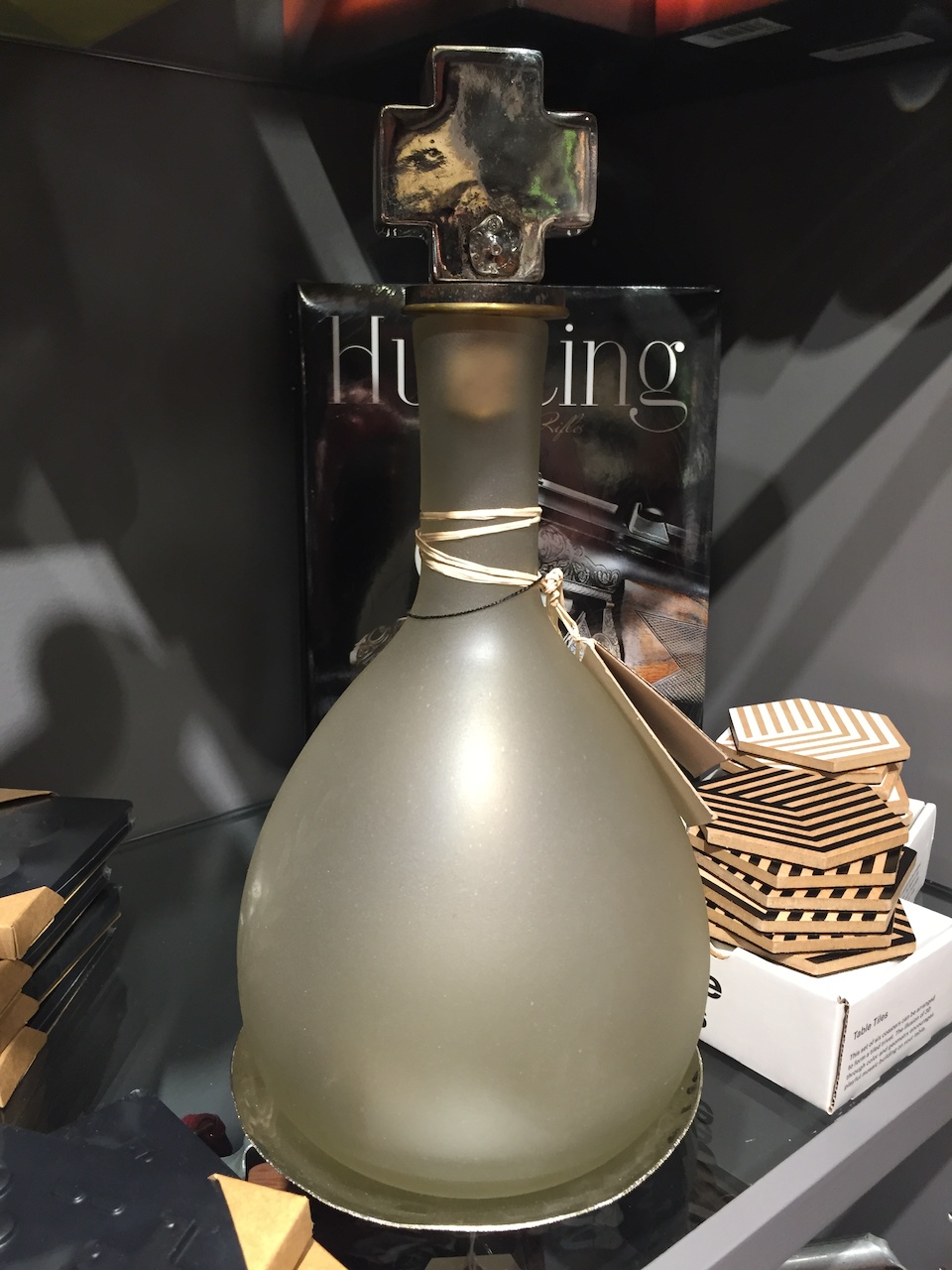 Decanter with nickel cross-shaped topper, $250, at 20twelve at the Dixon. Decanter with nickel cross-shaped topper, $250, at 20twelve at the Dixon.