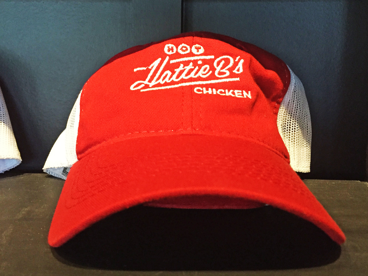 Any card-carrying, die-hard hot-chicken fan needs some Hattie B's swag like this sweet red trucker cap! Any card-carrying, die-hard hot-chicken fan needs some Hattie B's swag like this sweet red trucker cap!