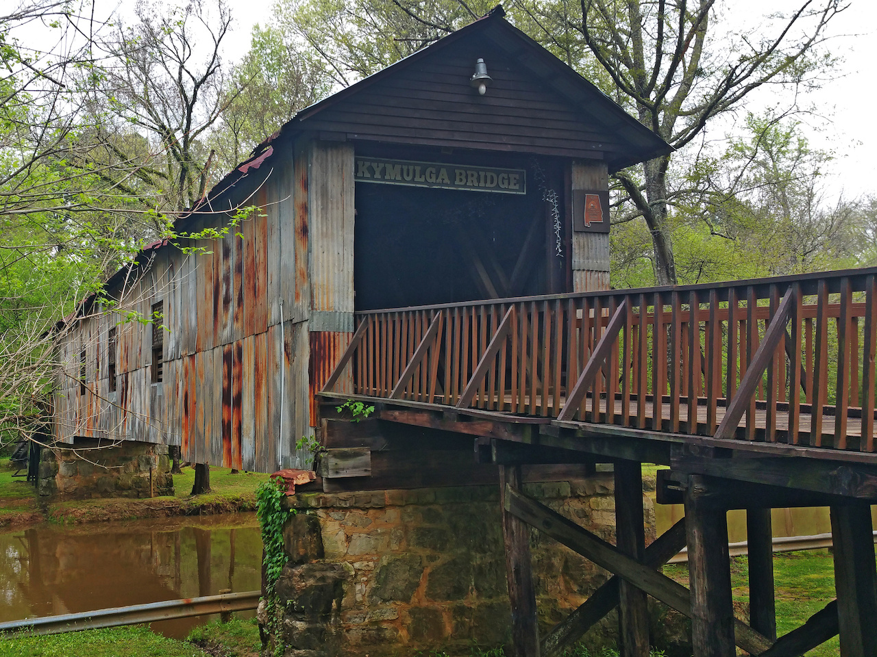 The tin siding of the Kymulga Bridge was added for economic and liability reasons. The tin siding of the Kymulga Bridge was added for economic and liability reasons.