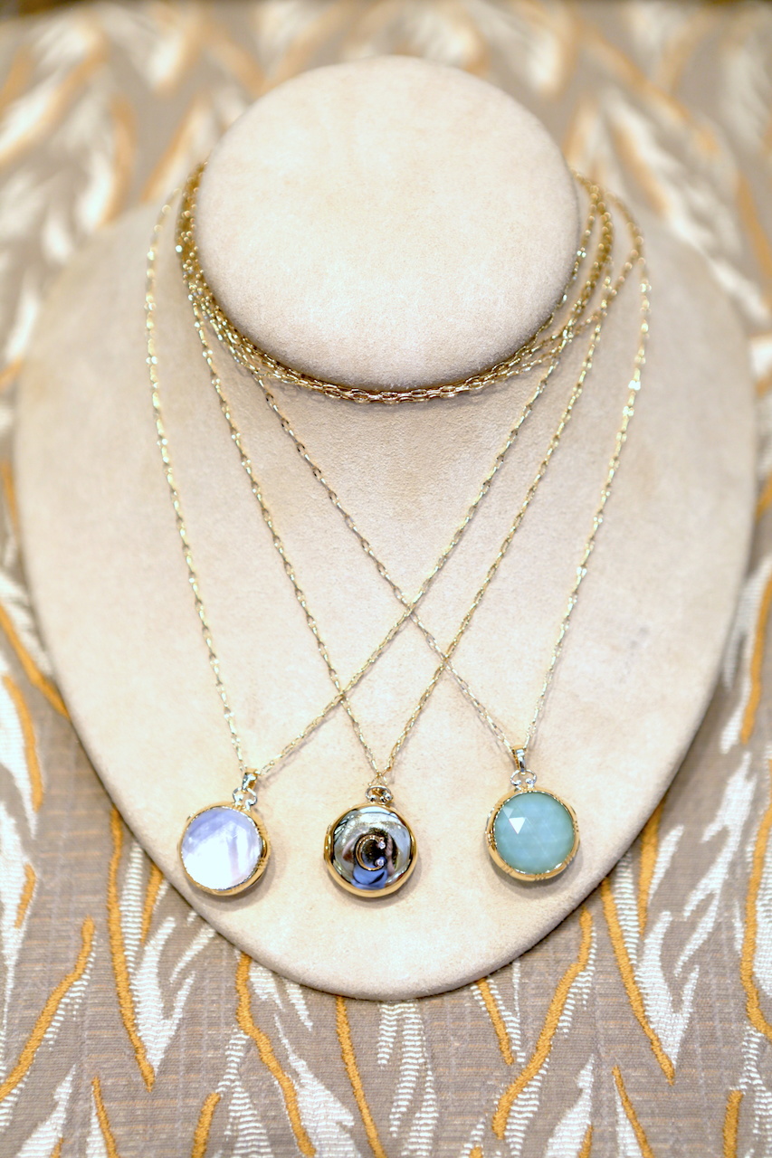 From <a href="http://www.mednikow.com/" target="_blank">Mednikow</a>, Monica Rich Kosann 18-karat yellow gold lockets, from left to right: gold bezel and rock crystal over mother-of-pearl doublet, $2,450; petite initial locket with two diamonds and rock crystal over cognac mother-of-pearl, $2,950; green opal slice underneath a faceted rock crystal locket, $2,450. . From <a href="http://www.mednikow.com/" target="_blank">Mednikow</a>, Monica Rich Kosann 18-karat yellow gold lockets, from left to right: gold bezel and rock crystal over mother-of-pearl doublet, $2,450; petite initial locket with two diamonds and rock crystal over cognac mother-of-pearl, $2,950; green opal slice underneath a faceted rock crystal locket, $2,450. .
