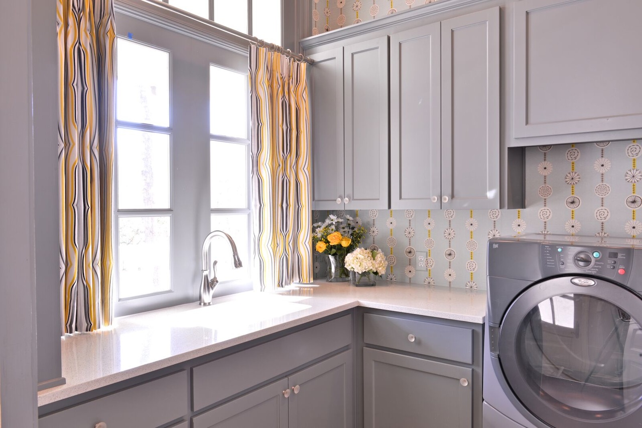 Even the laundry room stands out, thanks to drapery fabric from Duralee. Benjamin Moore’s Shaker Gray covers the cabinetry. Even the laundry room stands out, thanks to drapery fabric from Duralee. Benjamin Moore’s Shaker Gray covers the cabinetry.