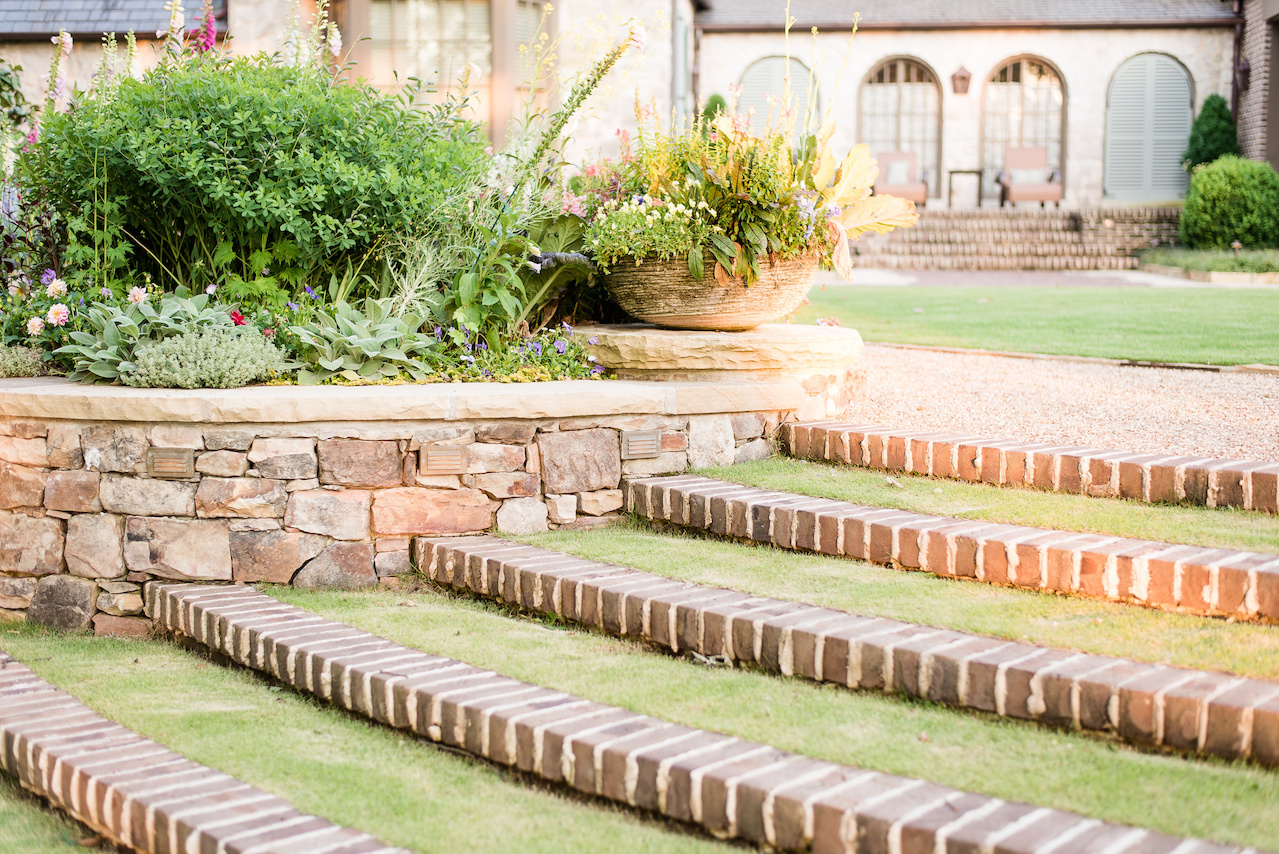 "The radial lawn steps with brick risers that cascade through the flower border down to the lower lawn are softer on the eye," says John. "They merge architecture into the garden in an elegant way." "The radial lawn steps with brick risers that cascade through the flower border down to the lower lawn are softer on the eye," says John. "They merge architecture into the garden in an elegant way."