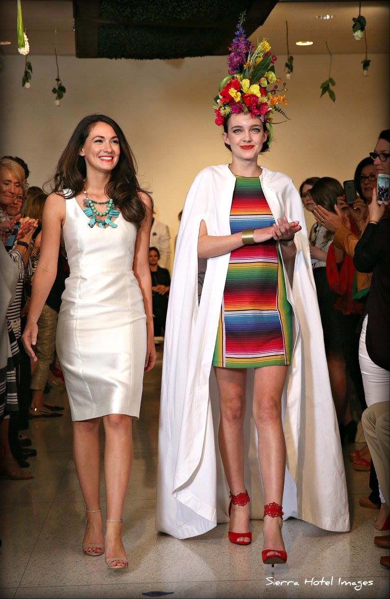 Designer Tara Skelley, left, walks the runway with one of her models. Designer Tara Skelley, left, walks the runway with one of her models.
