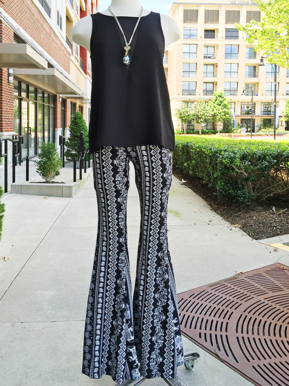 Keep patterned, flare pants in check with a neutral shirt. Collage Boutique flares StyleBlueprint Atlanta