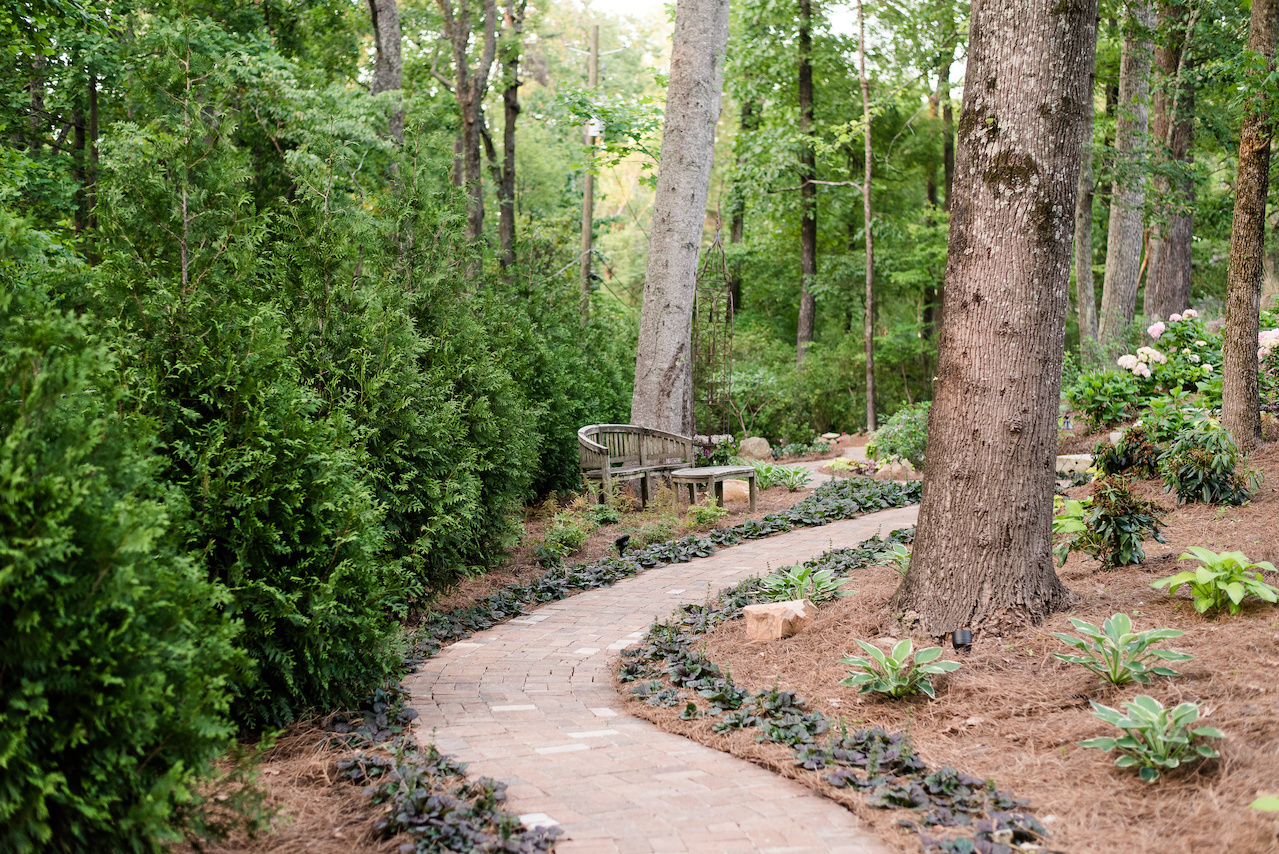 "Ajuga is a fantastic ground cover with purple blooms in the spring," says Clarke. "We wanted the pathway to blend in and for the ground cover along the edges to naturally accent it." "Ajuga is a fantastic ground cover with purple blooms in the spring," says Clarke. "We wanted the pathway to blend in and for the ground cover along the edges to naturally accent it."