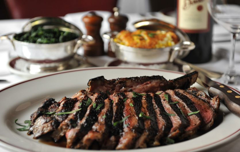 meaty goodness! There's nothing better than enjoying fine food, like that of Bone's. Here's a bone-in ribeye (for two), served with corn pudding and spinach. Image: <a href="http://www.beckysteinphotography.com/" target="_blank">Becky Stein</a>/<a href="http://www.ajc.com/" target="_blank">AJC</a>