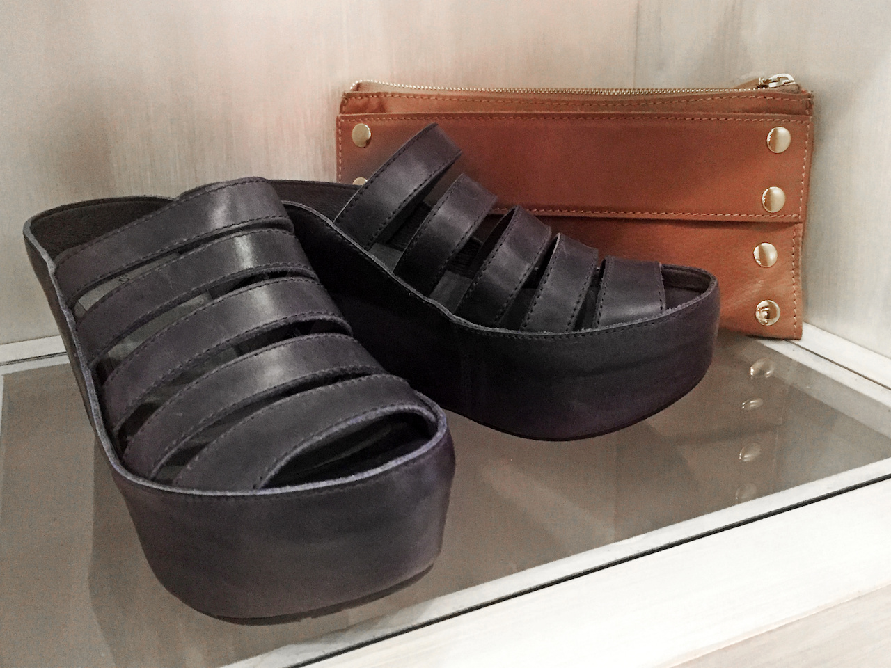 From Theadora Abbeyluxe: Chocolat Blu navy wedge sandals, $189; Hammit tan clutch, $250 From Theadora Abbeyluxe: Chocolat Blu navy wedge sandals, $189; Hammit tan clutch, $250