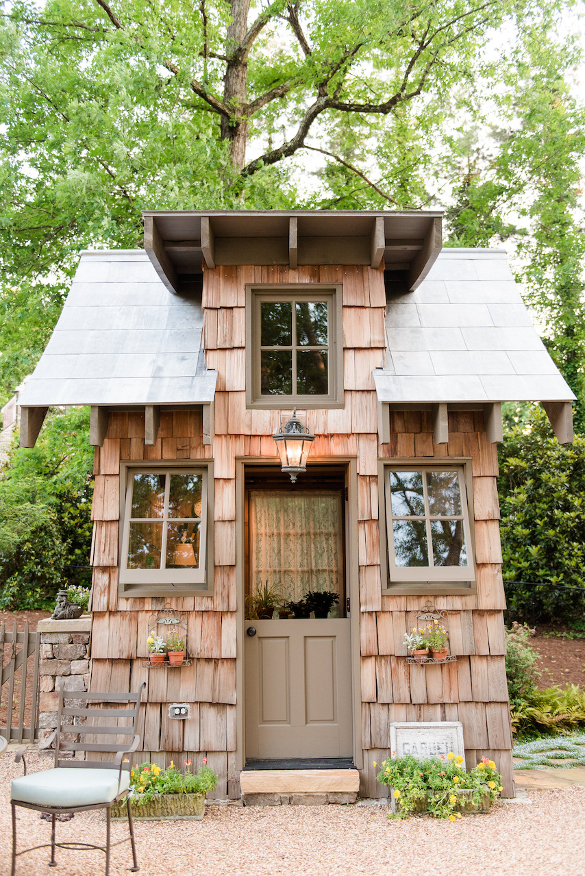The homeowner, an avid gardener, saw a gardening cottage online and fell in love, so John worked her dream gardening hut into the landscape. The homeowner, an avid gardener, saw a gardening cottage online and fell in love, so John worked her dream gardening hut into the landscape.