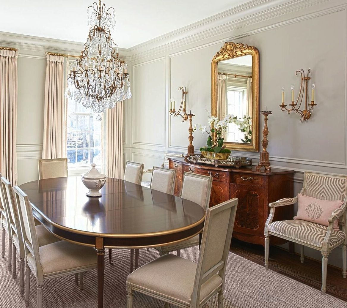 Schumacher fabric brings an elegant touch to the dining room on window treatments and upholstered chairs. The table is from Hickory Chair. Schumacher fabric brings an elegant touch to the dining room on window treatments and upholstered chairs. The table is from Hickory Chair.