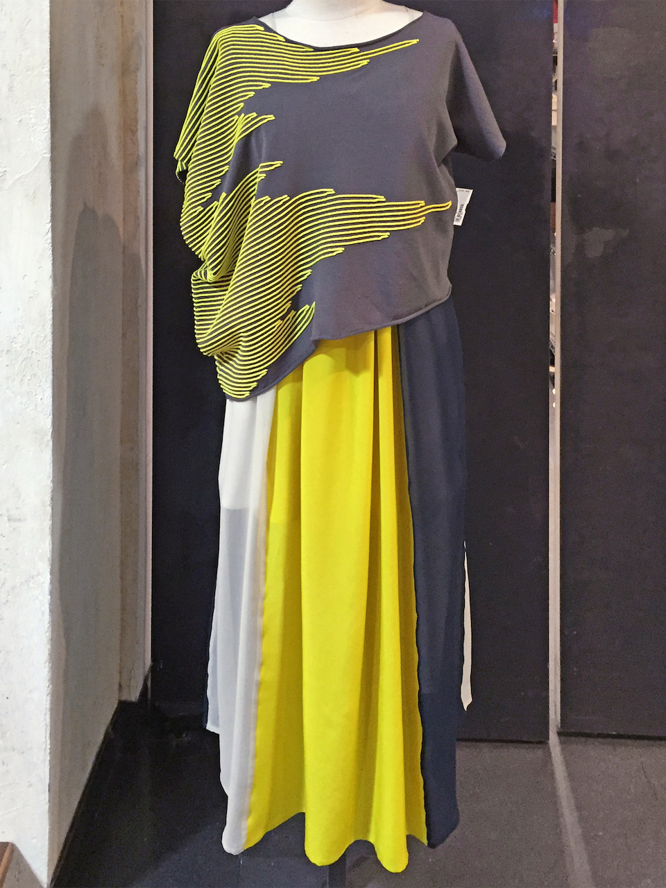 From Betsy Prince: Christian Wijants yellow and night blue silk dress, $641; Crea Concept yellow asymmetrical top, $338 From Betsy Prince: Christian Wijants yellow and night blue silk dress, $641; Crea Concept yellow asymmetrical top, $338