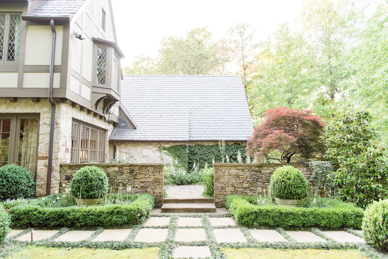 "The plantings along the facades of the house of boxwoods and mondo were used to simplify and unify the plantings," says John. "This approach is a classic look that can work well with almost any style of house." "The plantings along the facades of the house of boxwoods and mondo were used to simplify and unify the plantings," says John. "This approach is a classic look that can work well with almost any style of house."