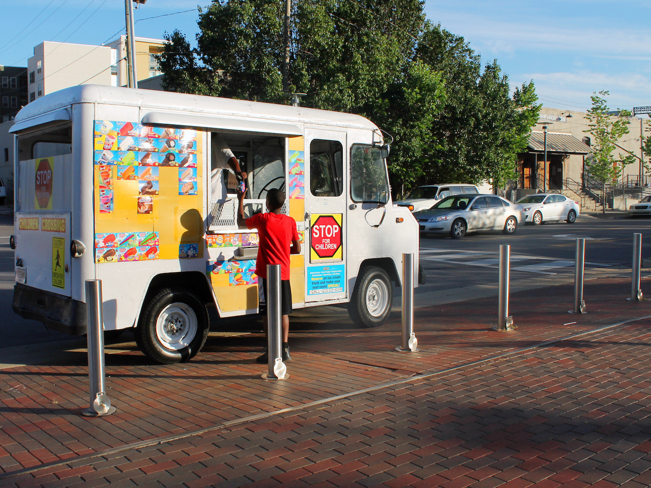 The ice cream truck often visits the park to offer sweet icy treats to parents and kids alike. The ice cream truck often visits the park to offer sweet icy treats to parents and kids alike.