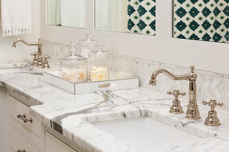 An upclose view of the marble veining bathroom fixtures