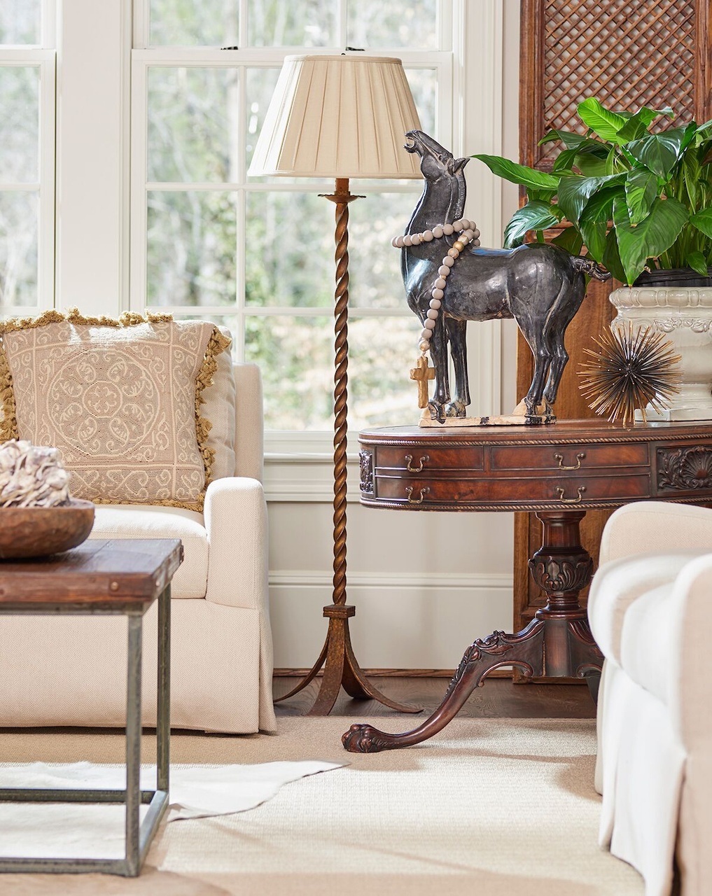 An antique table adds the patina of old wood to the family room. An antique table adds the patina of old wood to the family room.